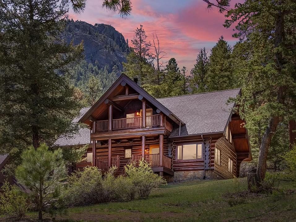 Beautiful log cabin home set on an acre minutes outside of the heart of Estes Park