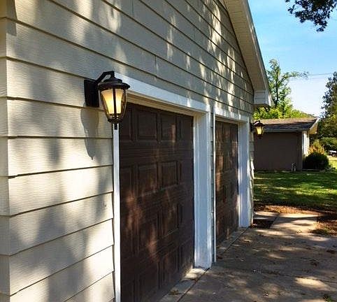 Insulated garage doors w/ walnut stain