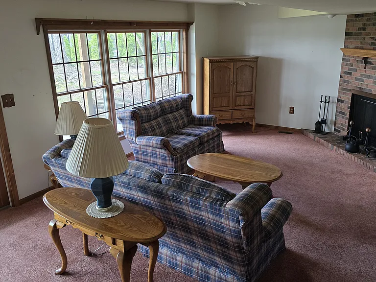Walkout basement living room with gas fireplace