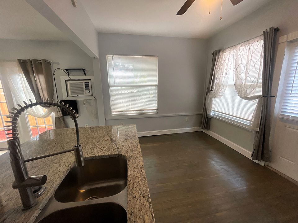 high end kitchen finishes and 
room for dining table or desk in corner