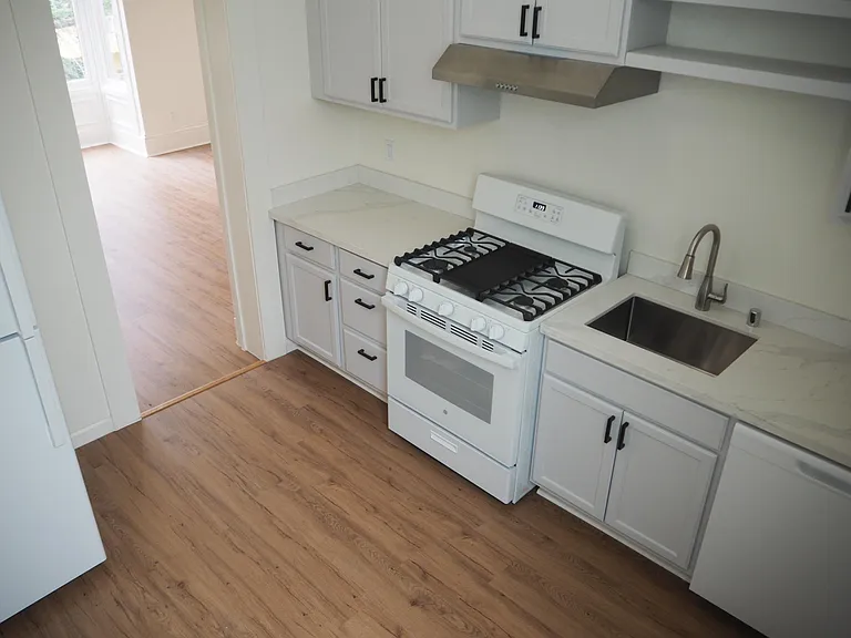 Completely remodeled new cabinets, stove, refrigerator, dishwasher.
