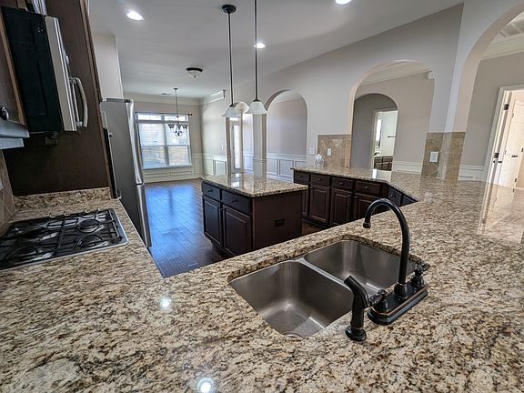 Luxury Kitchen with Stainless Appliances, Granite, and Double Ovens