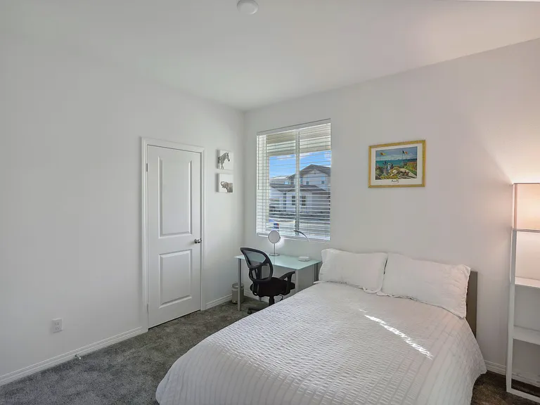 Drift off in this charming bedroom, complete with fresh linen.