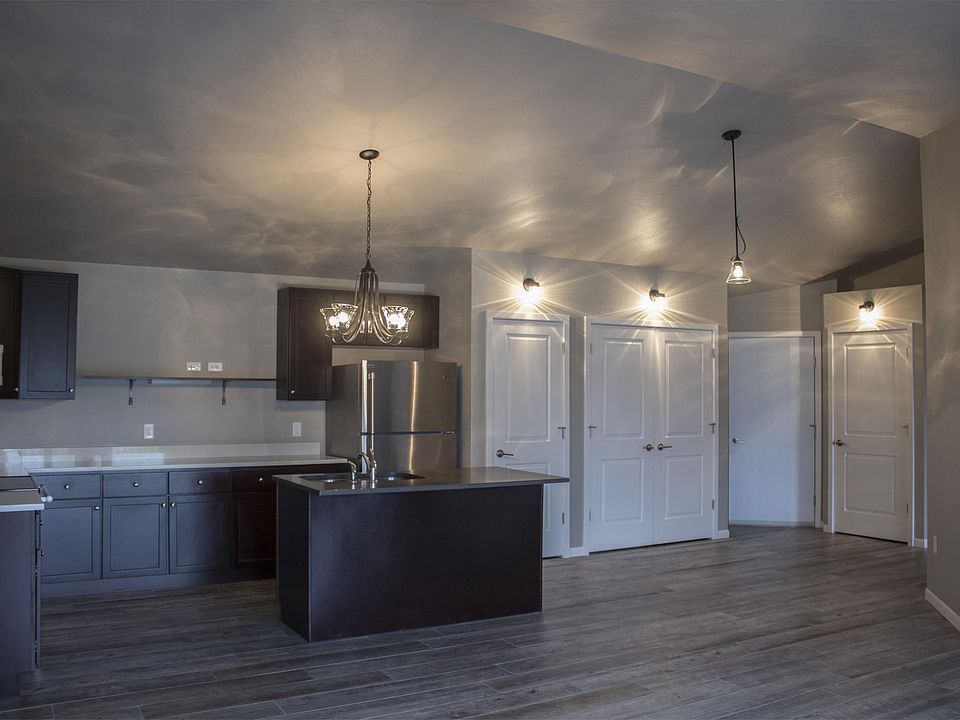 Kitchen, pantry, washer & dryer, entry, and closet doors from left to right.