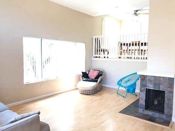 Large Living room ( 20'x17') has fireplace, Patio and coat Closet