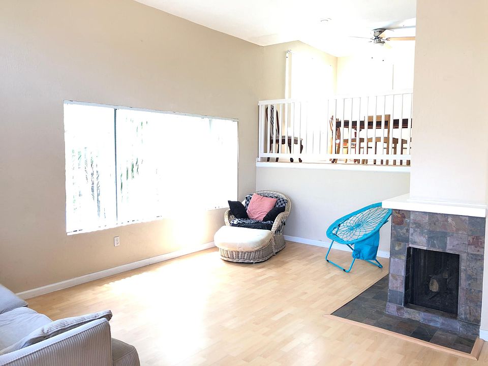 Large Living room ( 20'x17') has fireplace, Patio and coat Closet