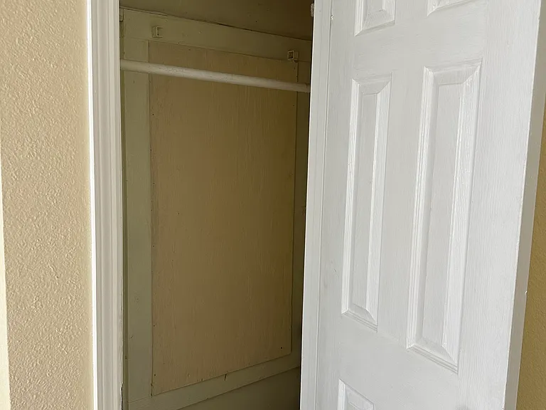 Back bedroom has deep closet.