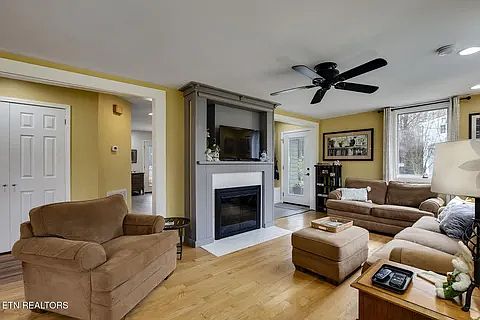 Living room with wood burning fireplace.