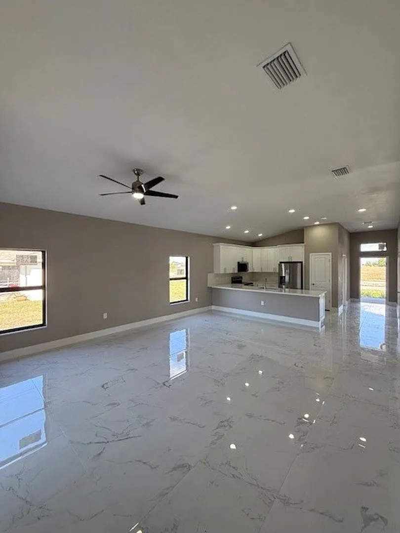 Brand-New Luxury Home with 3-Car Garage & Lawn Care Included | Modern Living in Cape Coral! — Photo 4