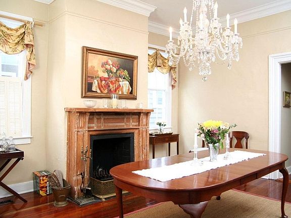 Formal Dining Room with chandelier that conveys