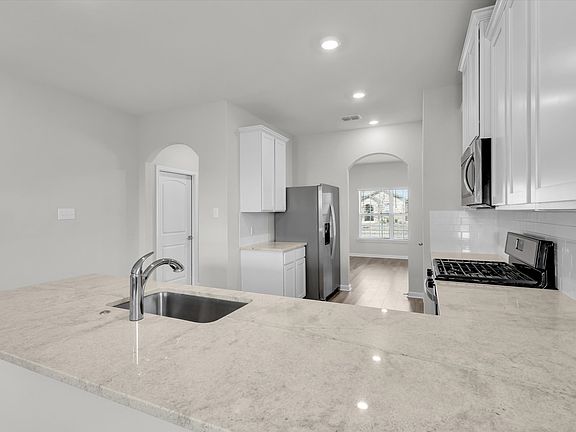 Kitchen with Quartz Countertops and Gas Range