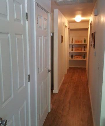 Hallway to 3 bedrooms. 2 rooms on the right and the bathroom and master on the left.