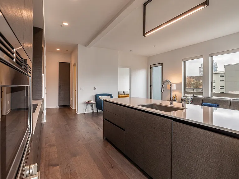 Apartment Interior Featuring Island Kitchen and Large Windows