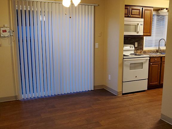 dining area , kitchen area with sliding door leading to a patio