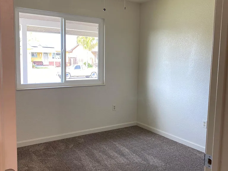 Bedroom, front of house, with fan