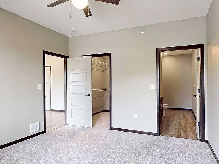Settle into a spacious bedroom with direct access to a walk-in closet and ensuite bathroom.