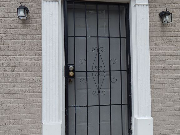 ENTRANCE TO PROPERTY -HAS COMMON FOYER ENTRANCE SHARED BY "