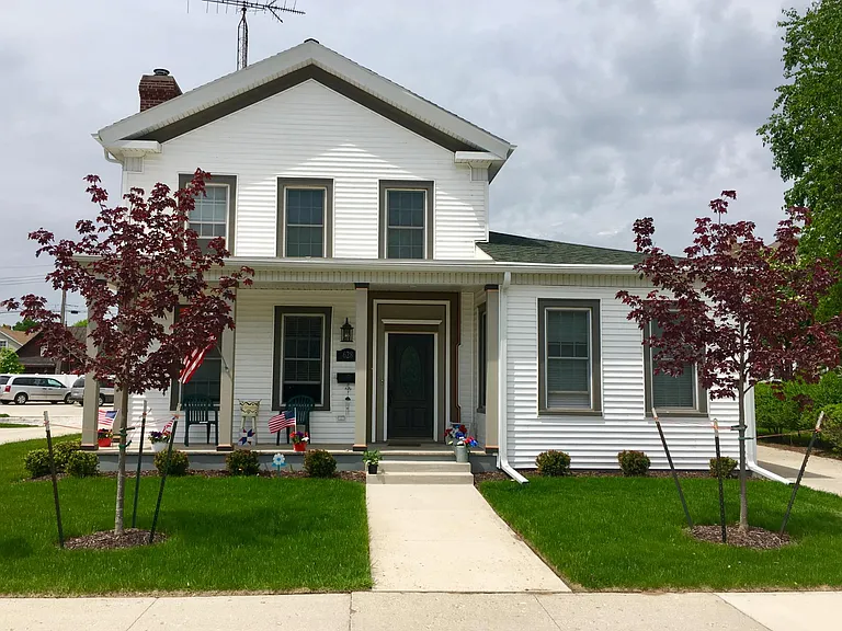 Front with large porch.