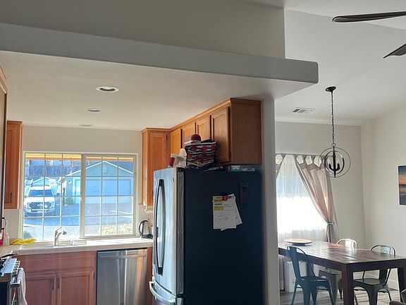 Open area kitchen with new appliances and comes with refrigerator