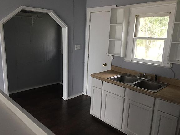 kitchen with washer and dryer connections in the nook
