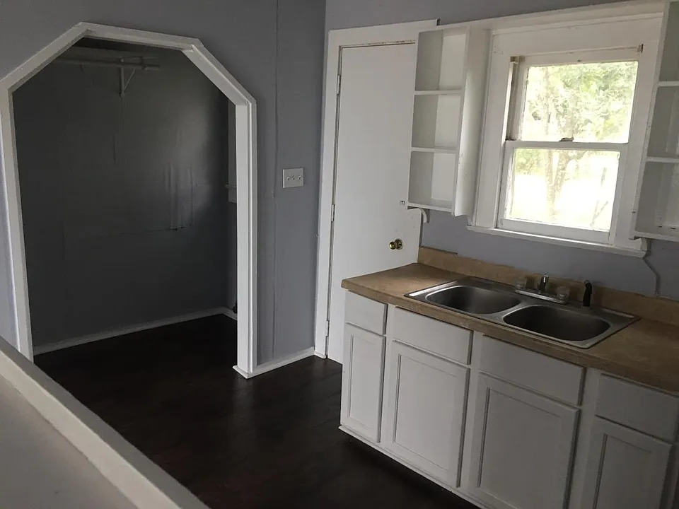 kitchen with washer and dryer connections in the nook