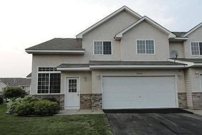 Exterior. End unit, two car attached garage.