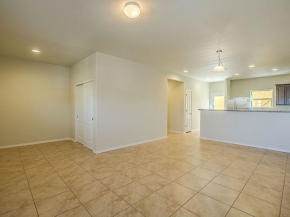 Open floor plan connects the living, dining and kitchen areas