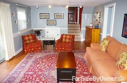 Family Room on Lower Level
						:
						Cherry Wood Pergo floor, natural gas fireplace