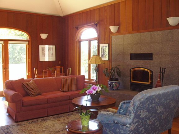 Impressive Living Room with cathedral ceilings, clear heart redwood paneling 