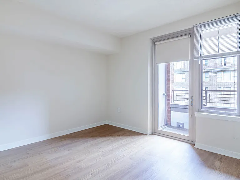 Bedroom with Balcony and Hard Surface Flooring
