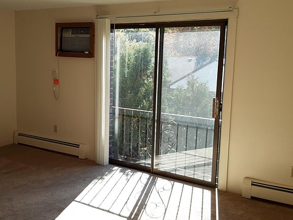Spacious living room with passthrough window to kitchen