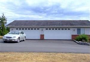 4 car detached garage next to main house plus shop office to right