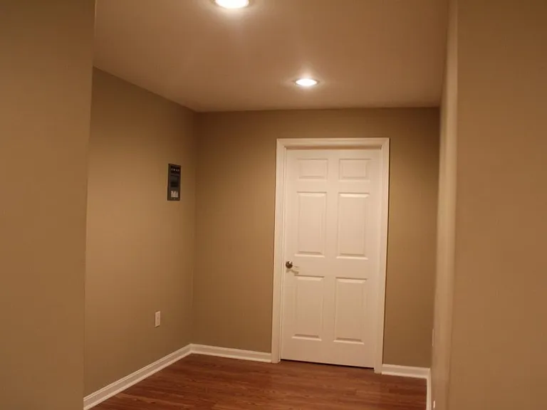 Basement study area, part of Bedroom #5, leads to full bathroom