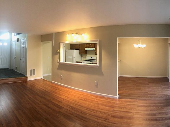 Living Room w/ Storage Closet, Dining Room & Kitchen beyond