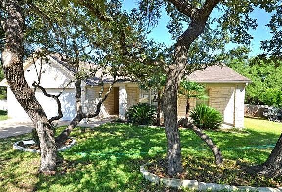 Native Live Oaks shade the front and back yards