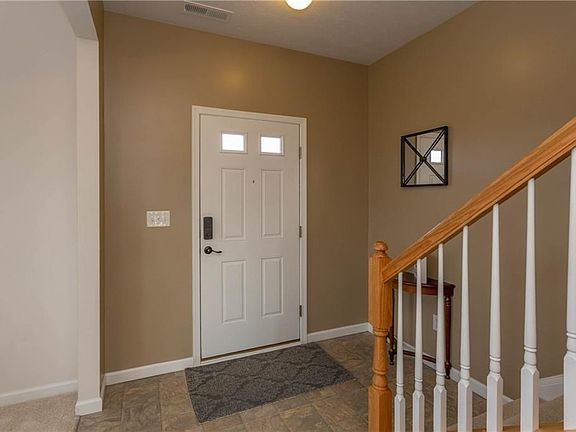 Spacious entry opens to stairway and living room and dining room