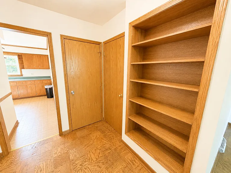Foyer Shelving, Kitchen Entrance, and Secondary Fire Exit