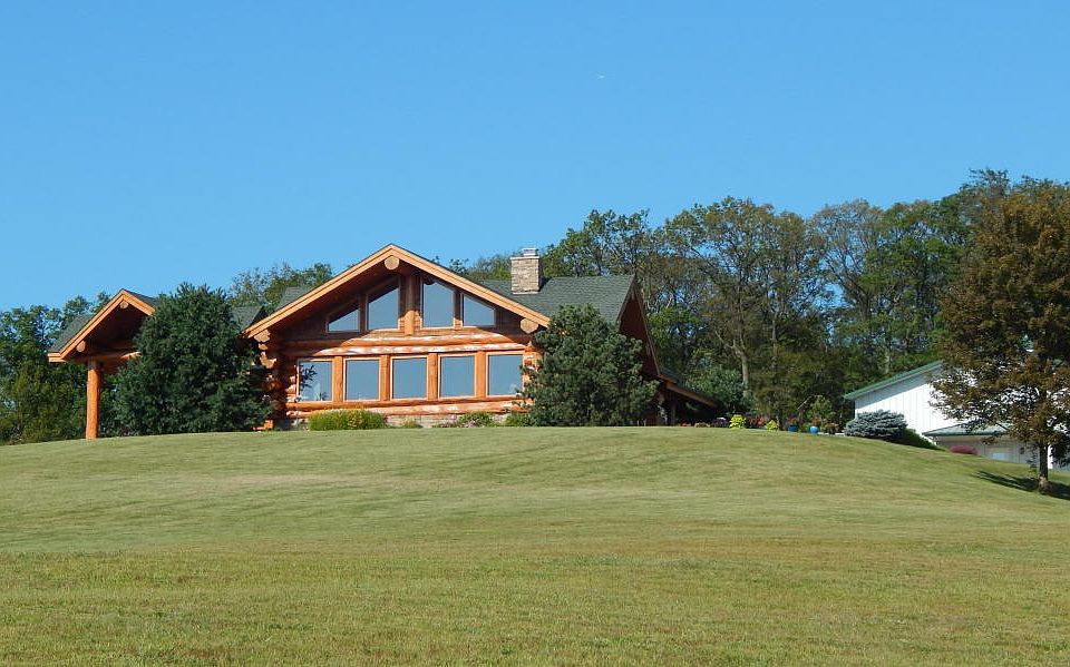 Log Home with large Morton Building with guest quarters.