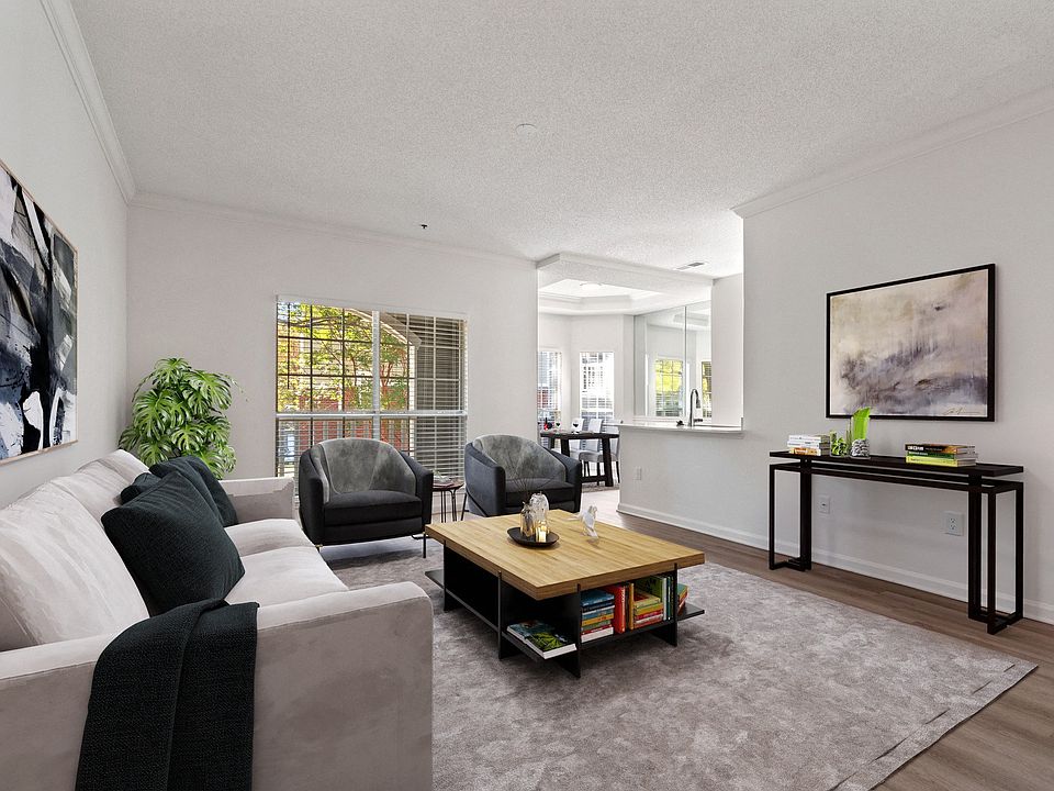 Living room with large floor to ceiling windows that offer an abundance of light