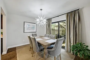 Dining room comfortably holds table for up to 8, plus built-in wet bar and doors to outside patio for grilling and al fresco dining.