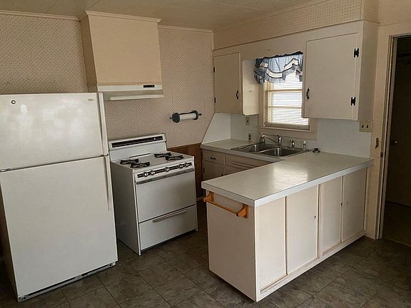 Kitchen with refrigerator and stove
