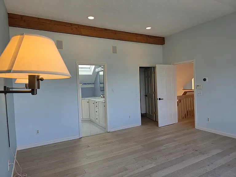 primary bedroom with private bath and walk in closet