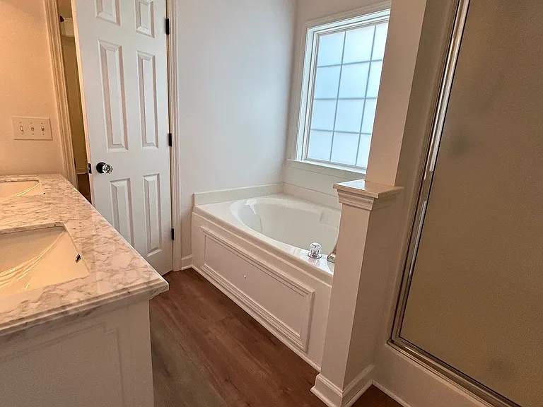 Master bath has large soaking tub and separate stand-up shower