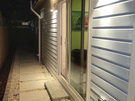 View of the side yard and separate patio door from the master bedroom