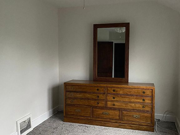 Large bedroom with ceiling fan (adjacent to restroom)