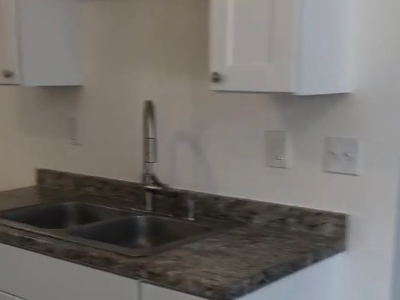 Stainless steel refrigerator has been added since this photo