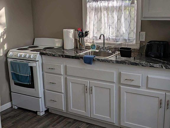 Full sized with with oven and sink.