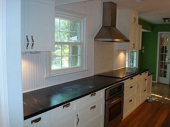 The kitchen has soapstone counters,new cabinets and state of the art appls.
