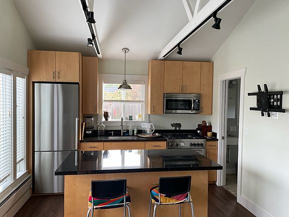 Kitchen/dining, door to bathroom. Mount for TV is down now, but can be installed.