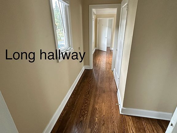 Long Hallwayfrom living room to bedroom with closet and space for bookcases